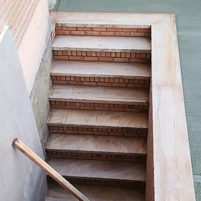 Sidewalk And Brickwork Basement Entry Stairs